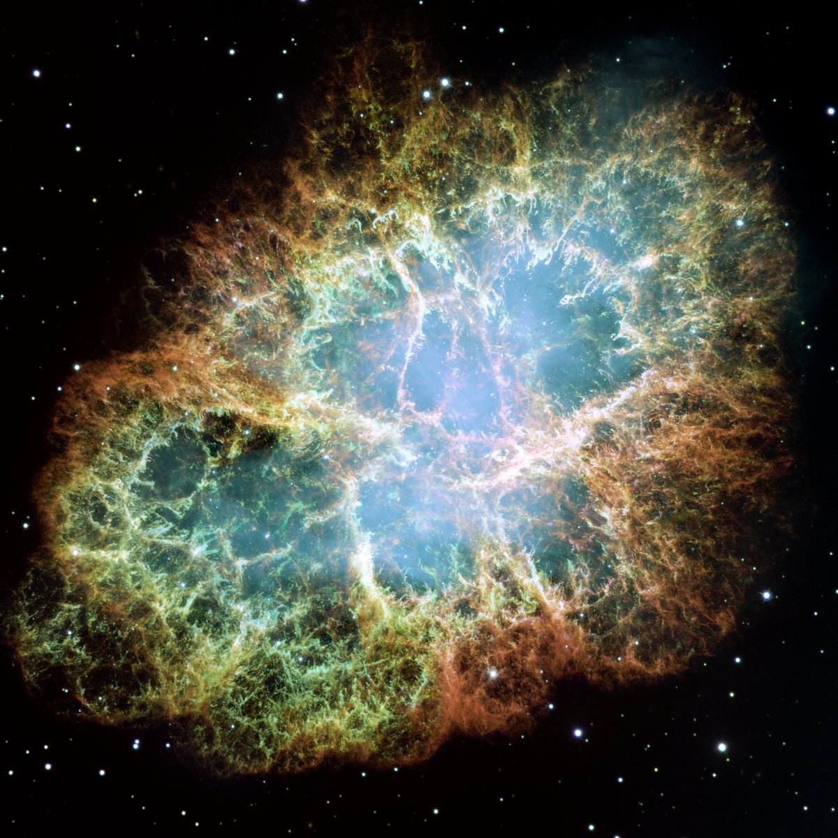 Mgławica Kraba — pozostałość po wybuchu supernowej z 1054 r., obserwowana teleskopem Hubble\'a. W jej centrum pozostała gwiazda neutronowa (pulsar); jeszcze masywniejsze gwiazdy zapadają się po wybuchu w czarne dziury. · źródło: NASA / ESA, Wikimedia Commons, domena publiczna