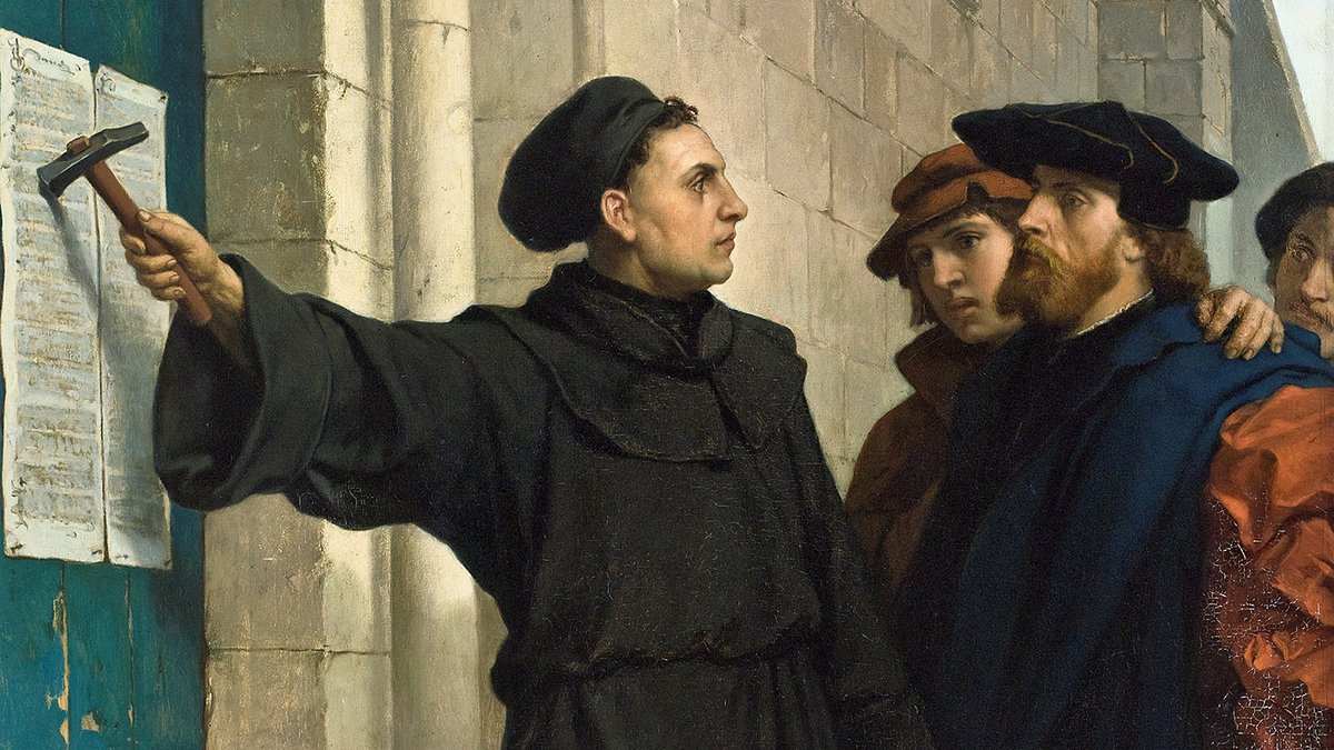 Marcin Luter przybijający 95 tez na drzwiach kościoła w Wittenberdze (obraz Ferdinanda Pauwelsa). Symboliczny początek reformacji 31 października 1517 r. · źródło: Ferdinand Pauwels, Wikimedia Commons, domena publiczna