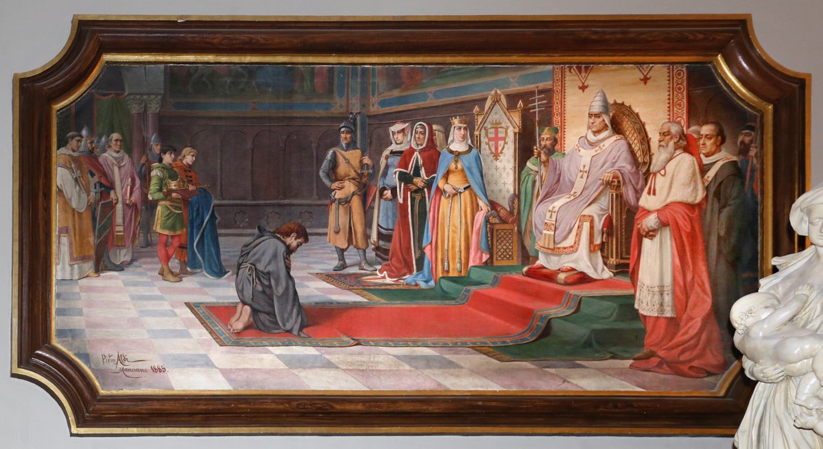 Henryk IV jako pokutnik pod Canossą (1077) — cesarz w stroju pielgrzyma czeka u stóp papieża Grzegorza VII. Spór o inwestyturę ukazał, że władza świecka może ugiąć się przed duchowną. · źródło: Pietro Aldi (fot. Sailko), Wikimedia Commons, CC BY 3.0