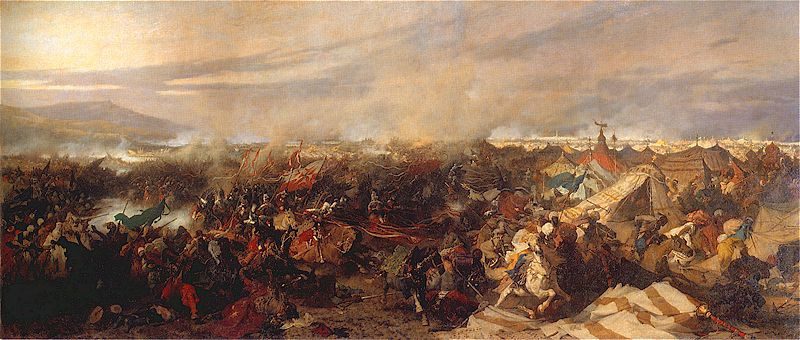Józef Brandt, Odsiecz Wiednia (1873) — kłębowisko jeźdźców w otwartym polu, w głębi namioty obozu i szeroki horyzont · źródło: Wikimedia Commons, domena publiczna