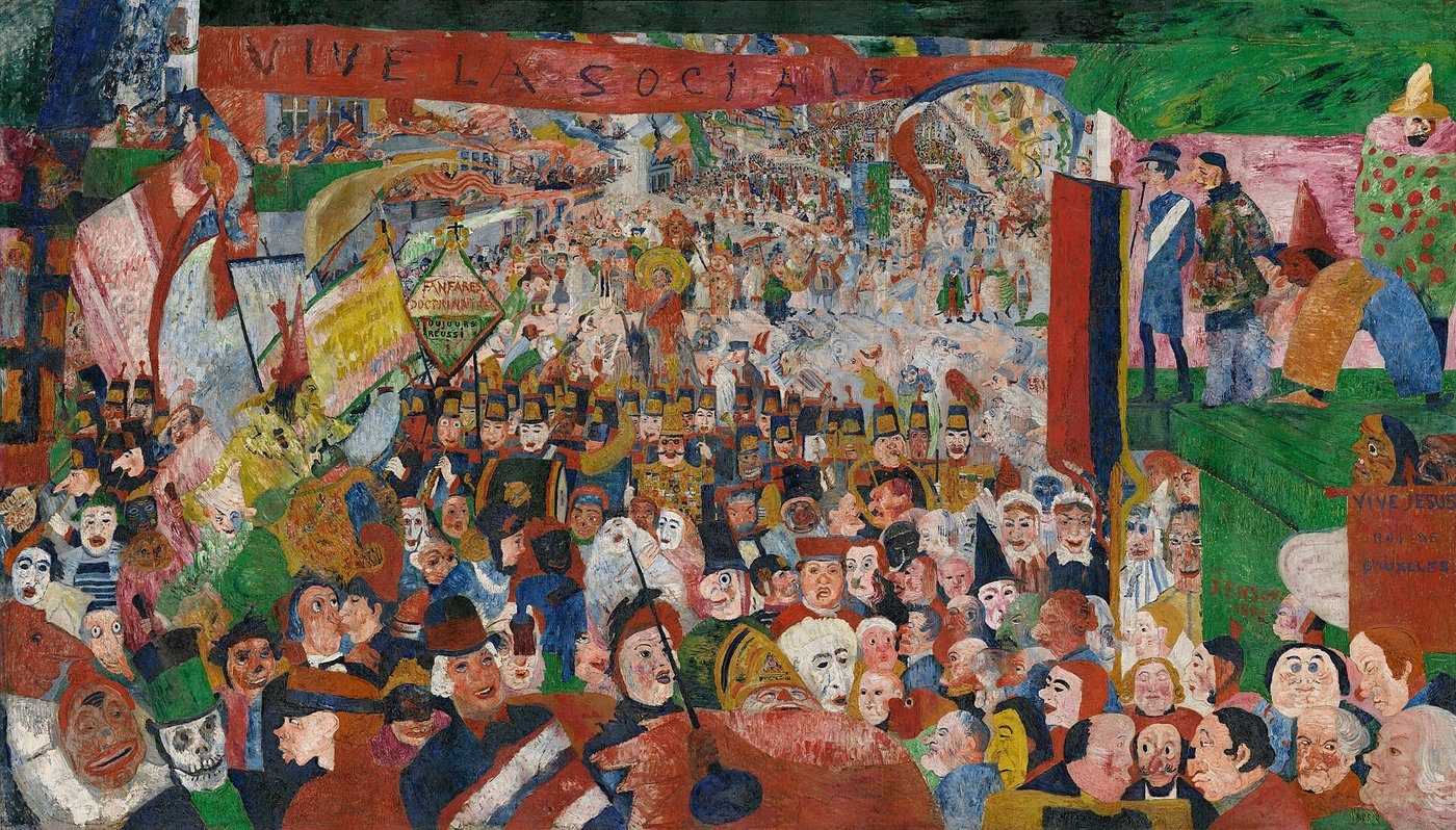 James Ensor, Wejście Chrystusa do Brukseli w 1889 (1888, J. Paul Getty Museum) — Chrystus ginie w tłumie karnawałowych masek; groteska jako krytyka mieszczańskiego fałszu · źródło: James Ensor, Wikimedia Commons, domena publiczna