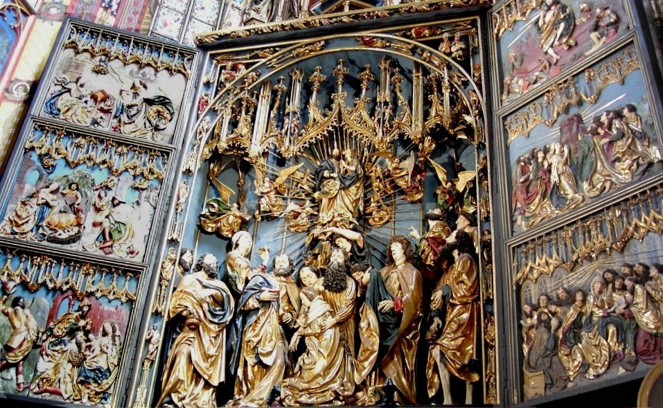 Wit Stwosz, Ołtarz Mariacki (1477–89, kościół Mariacki w Krakowie) — pentaptyk wys. ~13 m; Zaśnięcie Marii z ponaddwumetrowymi figurami apostołów, drewno lipowe, polichromia, złocenie · źródło: fot. Henryart, Wikimedia Commons, CC BY-SA 2.0